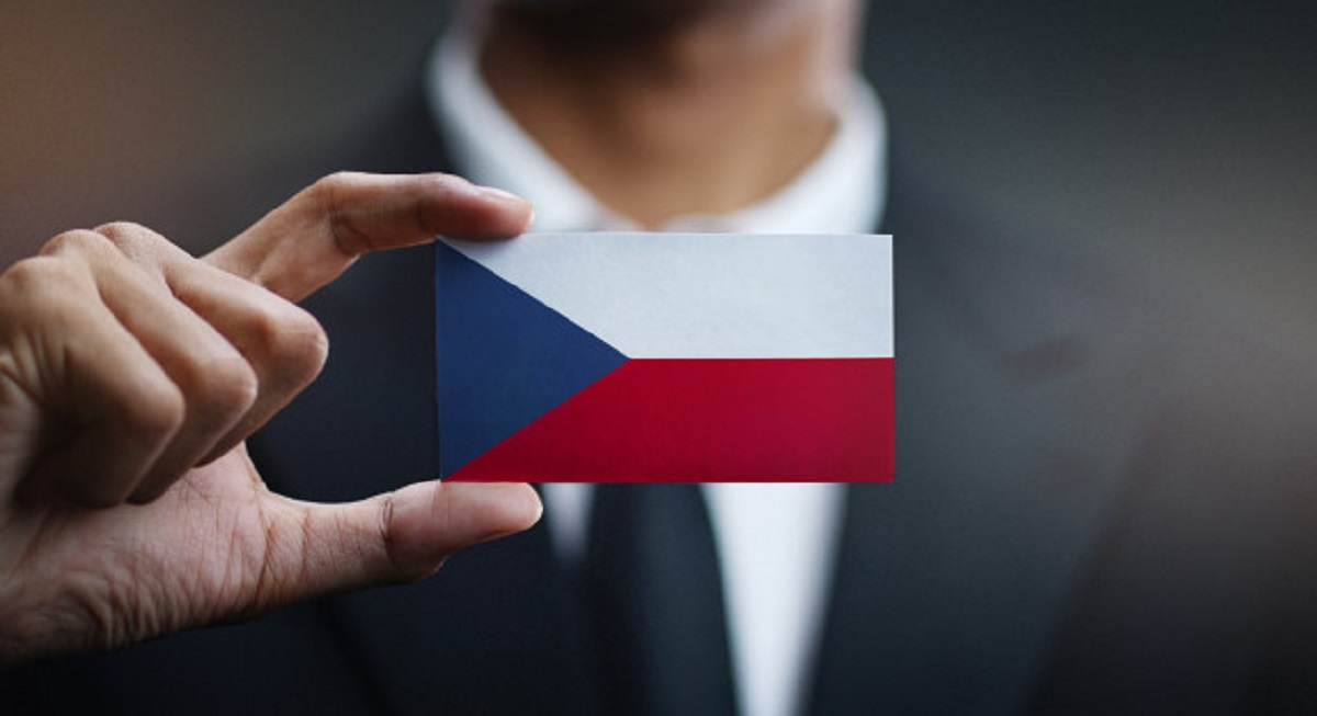 businessman-holding-card-czech-republic-flag_1379-3306